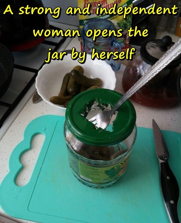 A strong and independent woman opens the jar by herself