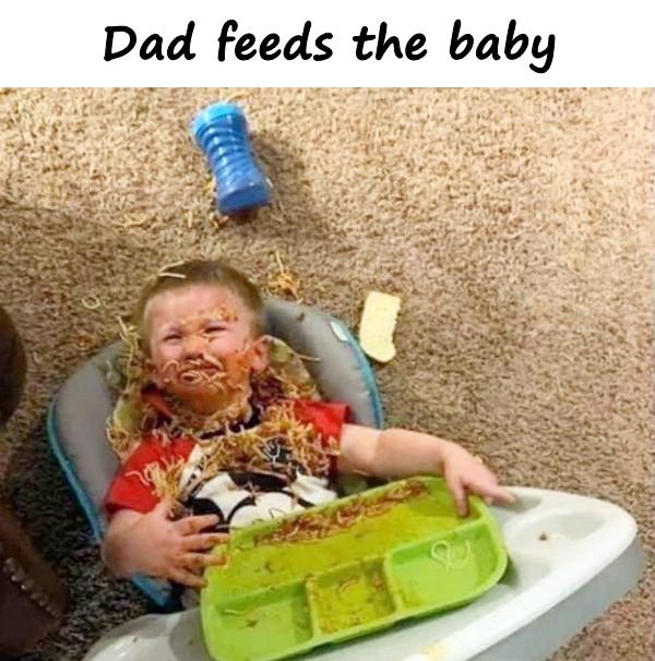 Dad feeds the baby