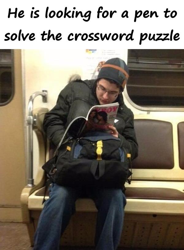 He is looking for a pen to solve the crossword puzzle