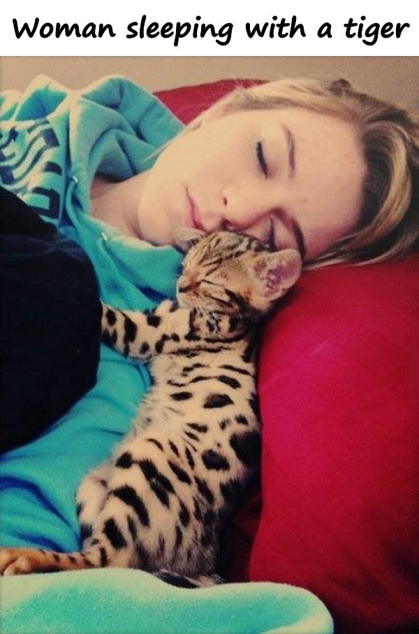 Woman sleeping with a tiger