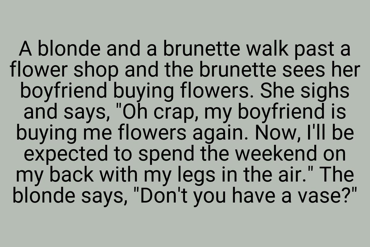 A blonde and a brunette walk past a flower shop and the