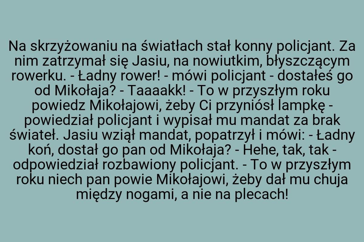 Na skrzyżowaniu na światłach stał konny policjant. Za nim