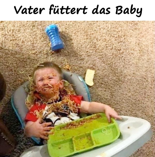 Vater füttert das Baby